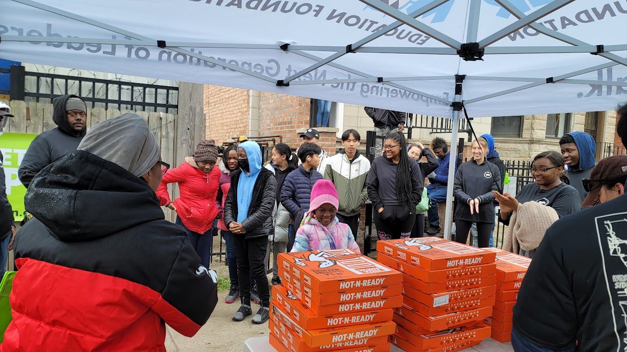 Neighbors lined up at a supply distribution tent