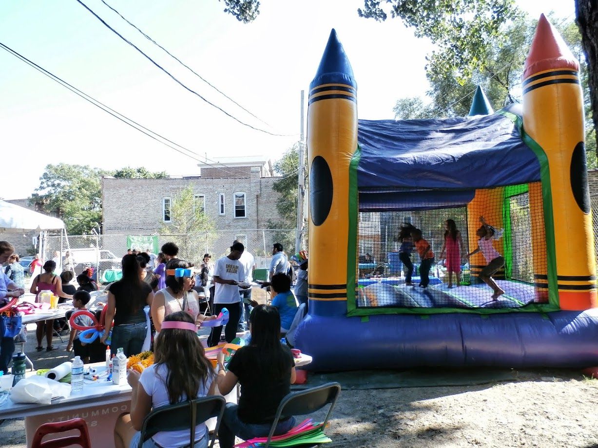 Children playing at a neighborhood family day