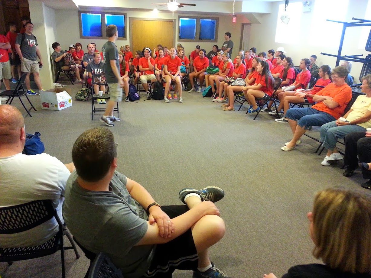 A group seated in the converted indoor sport center